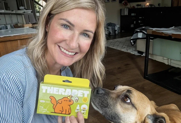 Smiling dog owner with her dog and the TheraPetMD kit
